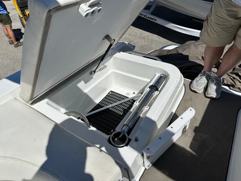Slide: The Image of Open storage compartment on a 2003 Cobalt 262 boat. - 47