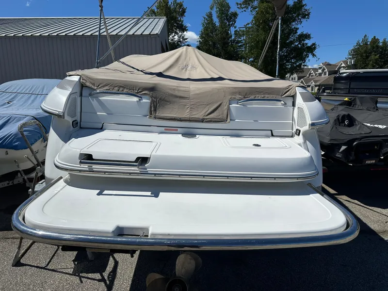 Slide: The Image of 2003 Cobalt 262 boat with covered seating area and swim platform. - 5