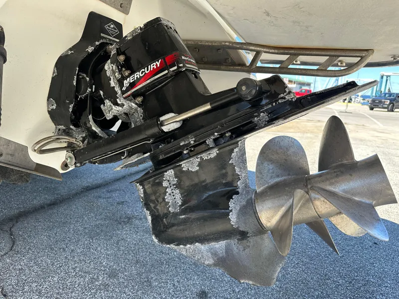 Slide: The Image of Close-up of a 2003 Cobalt 262 boat's Mercury outboard motor with visible corrosion. - 7