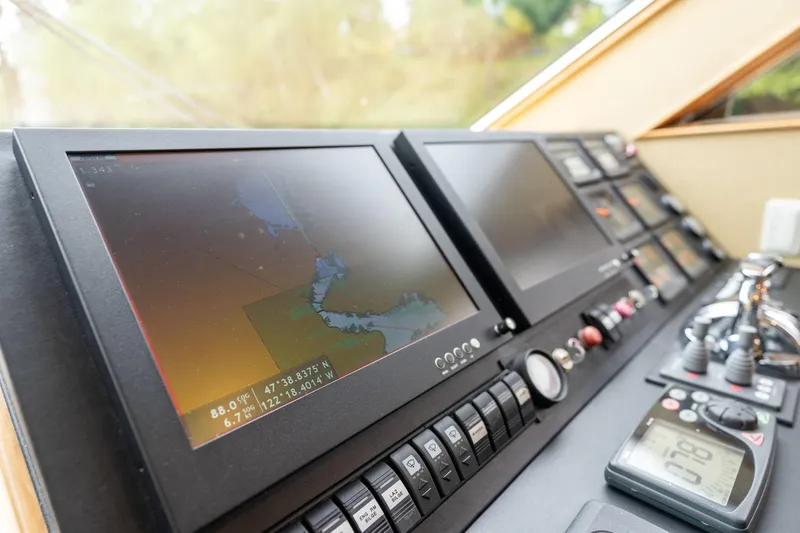 Slide: The Image of Control panel of 1999 Vitech 68' Pilothouse yacht with navigation screens and instruments. - 21