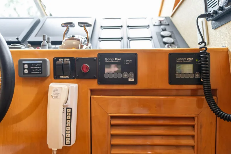 Slide: The Image of Control panel of 1999 Vitech 68' Pilothouse yacht with communication devices and gauges. - 26