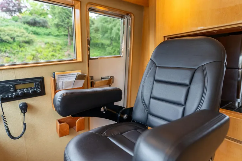 Slide: The Image of Luxurious pilothouse interior of 1999 Vitech 68' yacht with leather captain's chair. - 29