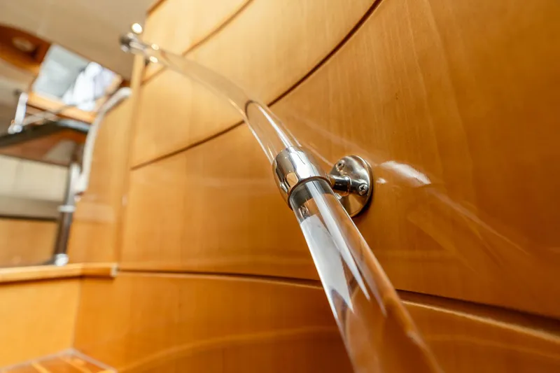 Slide: The Image of Elegant wooden interior of 1999 Vitech 68' Pilothouse yacht with sleek handrail design. - 31