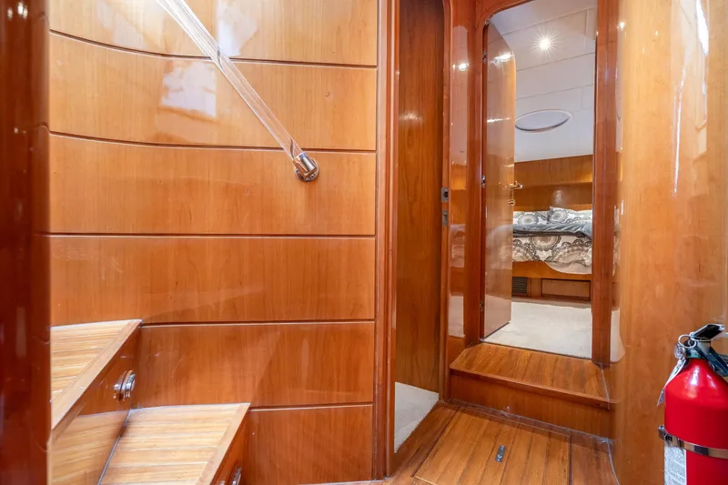Slide: The Image of Interior of 1999 Vitech 68' Pilothouse yacht with wooden stairs and hallway. - 32