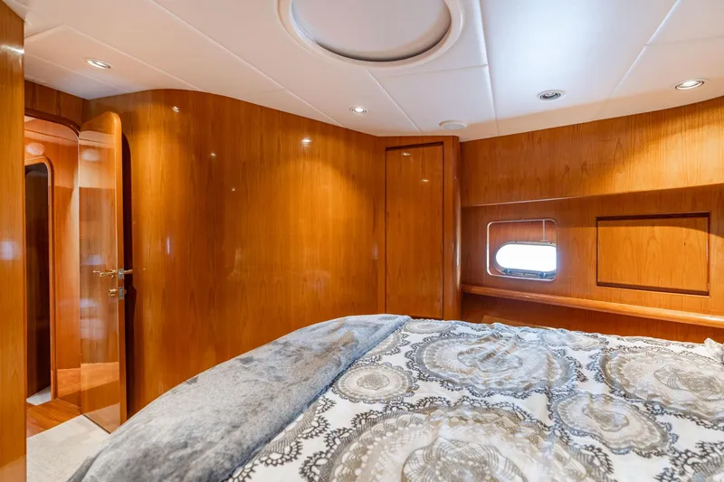 Slide: The Image of Luxurious cabin interior of 1999 Vitech 68' Pilothouse yacht with elegant wood paneling. - 36