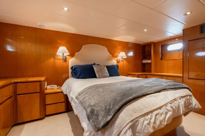 Slide: The Image of Luxurious bedroom interior of 1999 Vitech 68' Pilothouse yacht with cozy lighting and elegant decor. - 44
