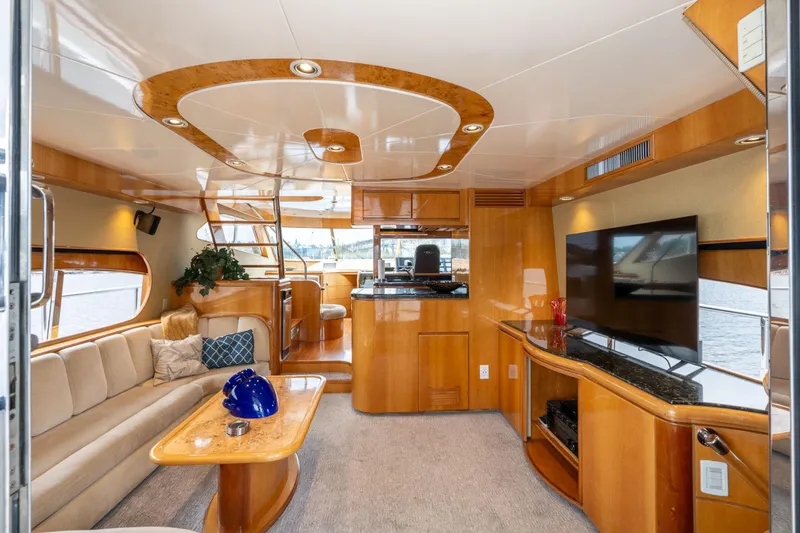 Slide: The Image of Luxurious interior of 1999 Vitech 68' Pilothouse yacht with elegant wood finishes and modern amenities. - 8