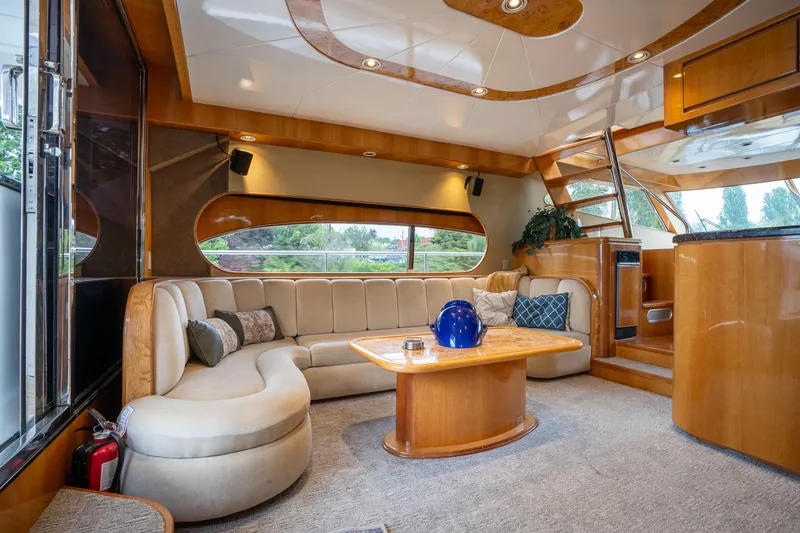 Slide: The Image of Luxurious interior of 1999 Vitech 68' Pilothouse yacht with elegant seating and modern design. - 9