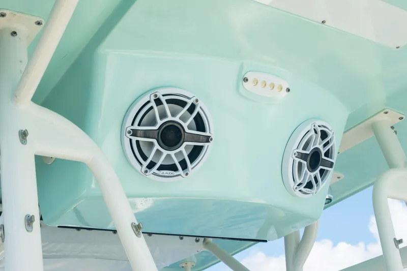 Slide: The Image of Speakers and lights on a 2000 Pursuit 2870 Center Console boat. - 13