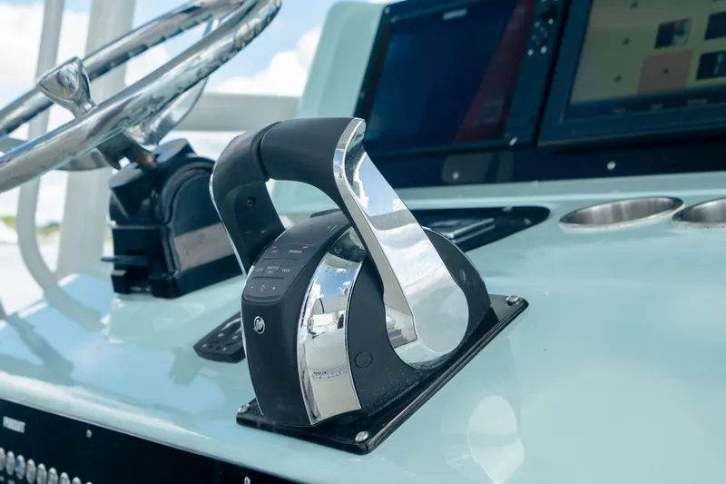 Slide: The Image of Close-up of the control panel on a 2000 Pursuit 2870 Center Console boat. - 17