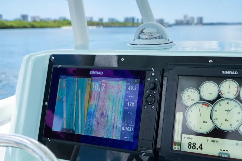 Slide: The Image of Close-up of 2000 Pursuit 2870 Center Console boat's navigation and instrument panel. - 26