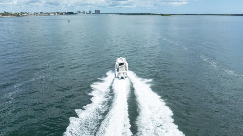 Slide: The Image of Pursuit 2870 Center Console boat cruising on open water, 2000 model. - 5