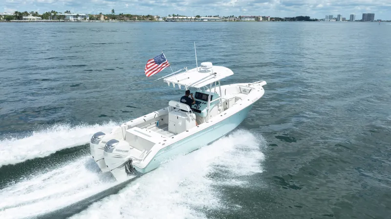 Slide: The Image of 2000 Pursuit 2870 Center Console boat cruising on open water. - 6