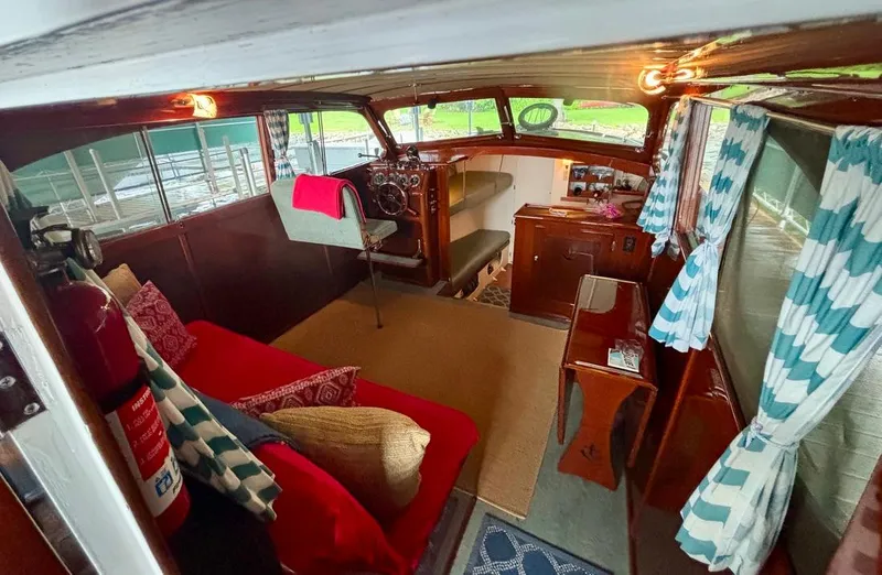 Slide: The Image of Interior of a 1954 Chris-Craft Sedan Cruiser with vintage decor and seating. - 5