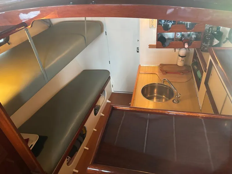 Slide: The Image of 1954 Chris-Craft Sedan Cruiser interior with bunk beds and compact kitchen area. - 6