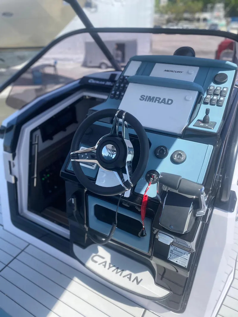 Slide: The Image of 2025 Ranieri CAYMAN 38.0 EXECUTIVE boat helm with Simrad navigation system. - 11