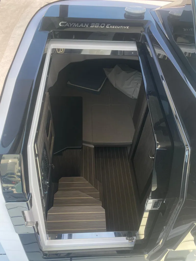 Slide: The Image of 2025 Ranieri CAYMAN 38.0 EXECUTIVE boat interior view with stairs and cabin. - 16