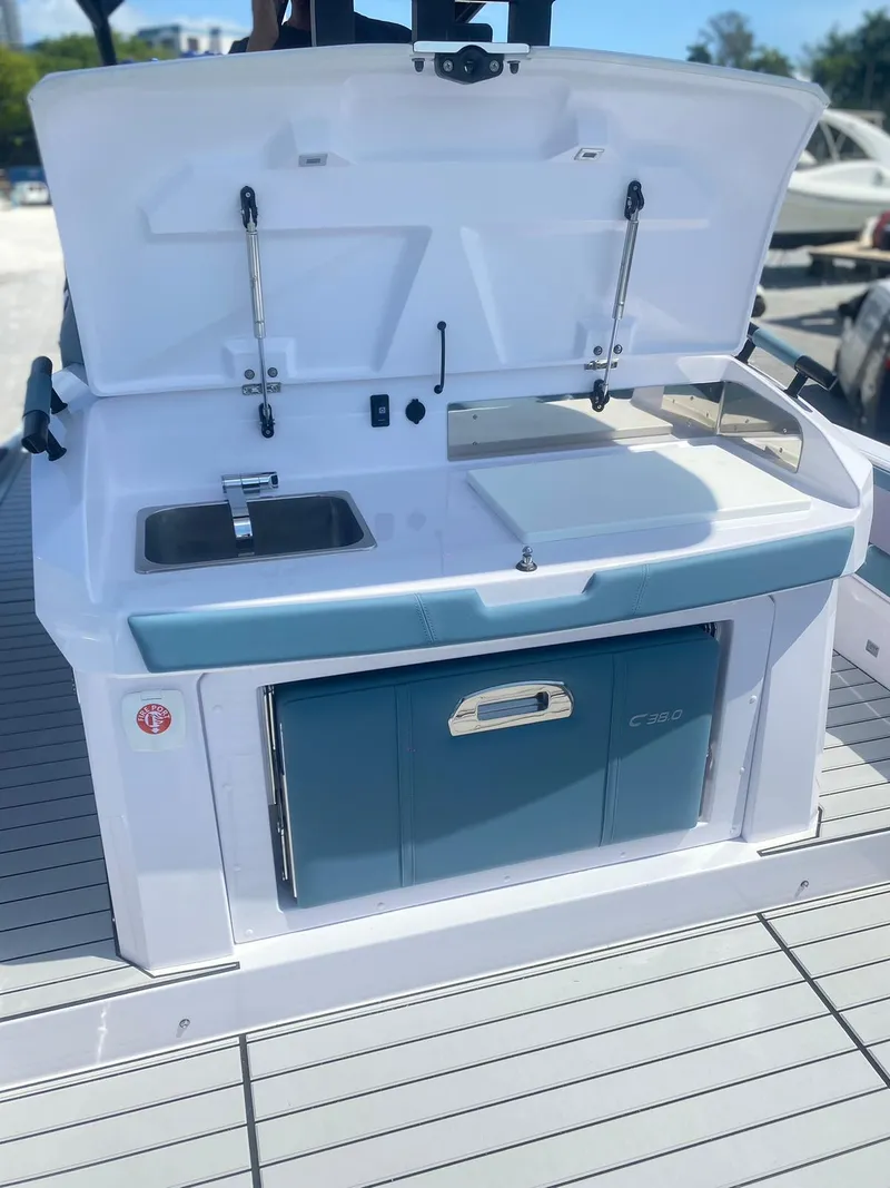 Slide: The Image of 2025 Ranieri CAYMAN 38.0 EXECUTIVE boat kitchen area with sink and storage. - 19
