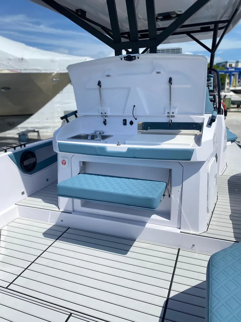 Slide: The Image of 2025 Ranieri CAYMAN 38.0 EXECUTIVE boat interior with open storage and seating. - 24