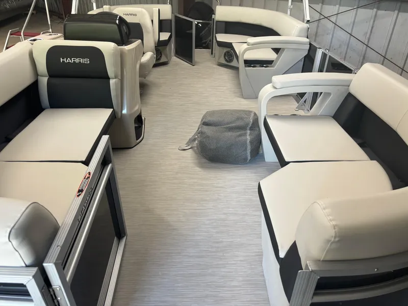 Slide: The Image of 2025 Harris Breeze 210 boat interior with spacious seating and modern design. - 3