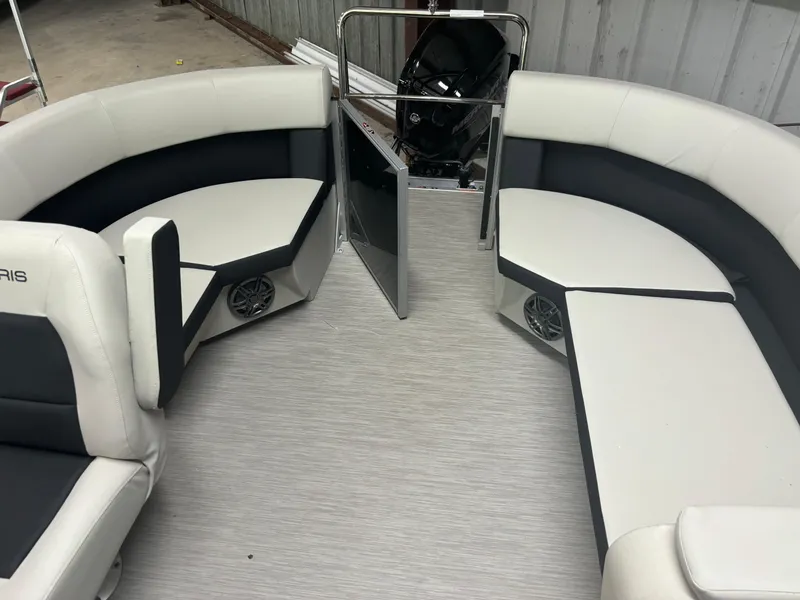 Slide: The Image of 2025 Harris Breeze 210 boat interior with white and black seating. - 4