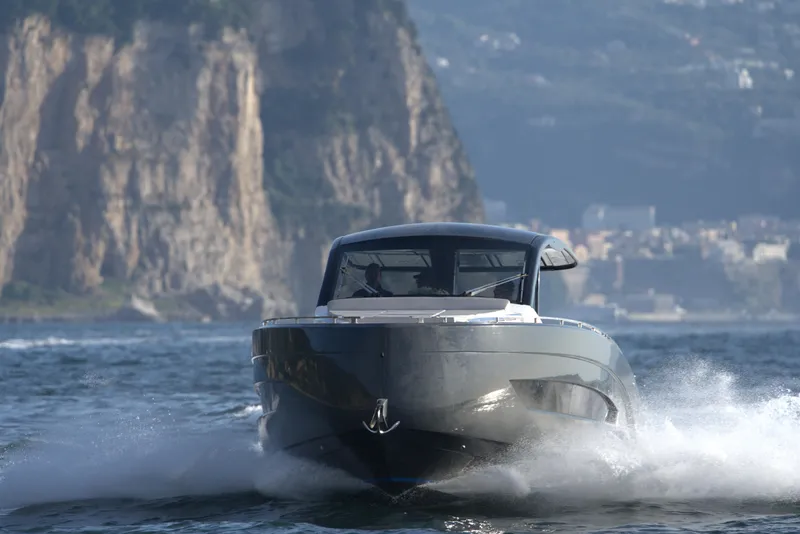 The Image of Nassima Yacht N40 2025 model cruising on water with scenic cliff background. - 0