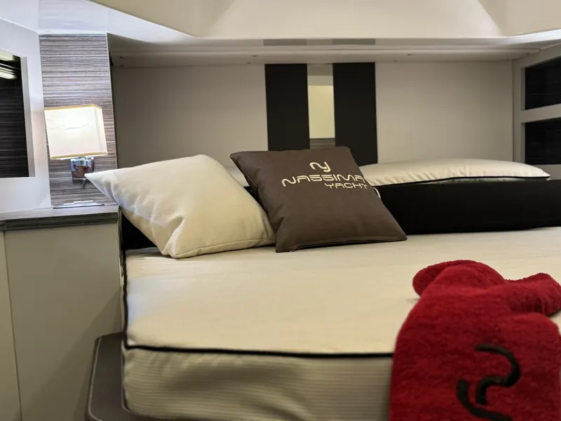 Slide: The Image of Luxurious bedroom interior of Nassima Yacht N40, 2025 model, featuring elegant bedding and modern design. - 10