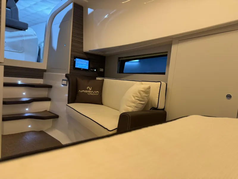 Slide: The Image of Luxurious interior of Nassima Yacht N40, 2025 model, featuring modern seating and ambient lighting. - 13