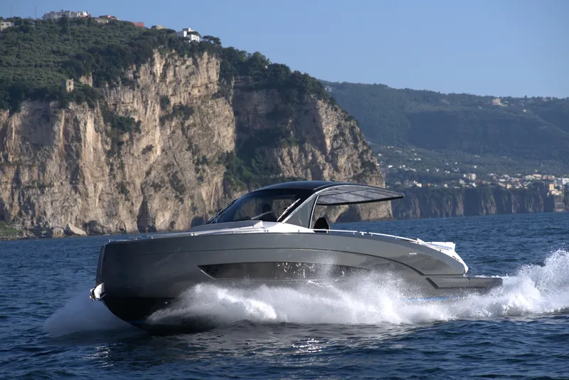 Slide: The Image of Nassima Yacht N40 2025 cruising near scenic cliffs on a sunny day. - 9