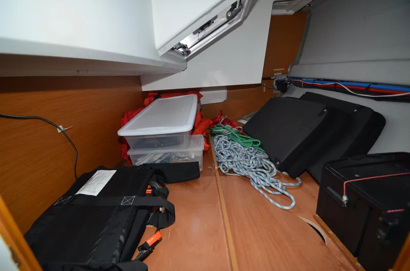 Slide: The Image of Storage area in a 2015 Jeanneau 349 sailboat with ropes and equipment. - 31
