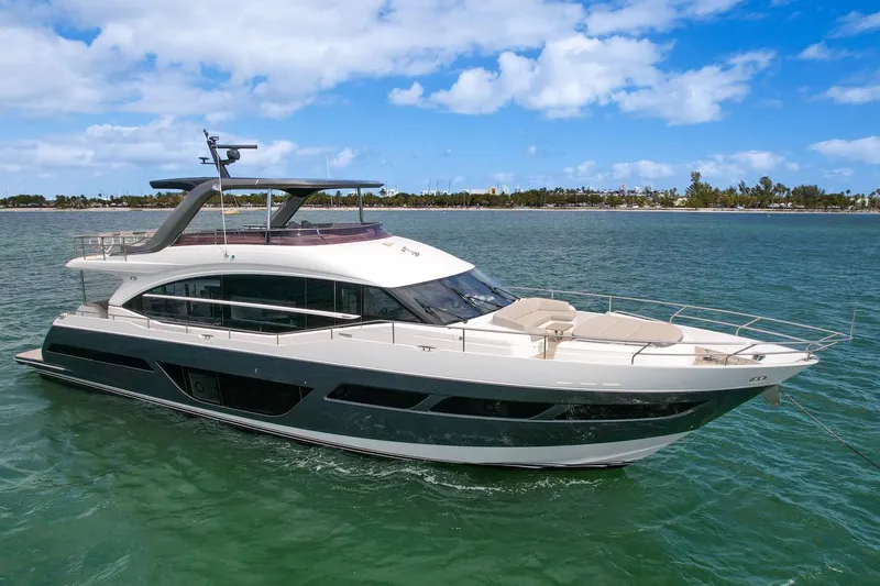 Slide: The Image of Luxury 2021 Princess Y78 yacht cruising on a sunny day. - 2