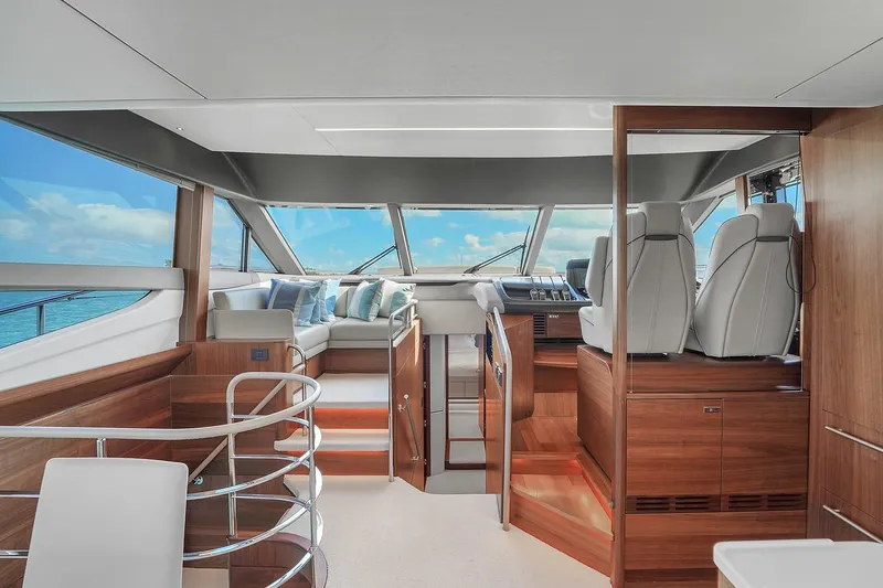 Slide: The Image of Luxurious interior of the 2021 Princess Y78 yacht with modern seating and panoramic windows. - 28