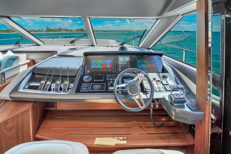 Slide: The Image of Luxury yacht Princess Y78 2021 helm station with advanced navigation controls and panoramic sea view. - 36