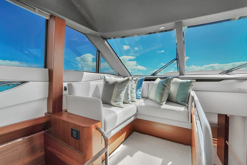 Slide: The Image of Luxurious interior of 2021 Princess Y78 yacht with panoramic windows and plush seating. - 37
