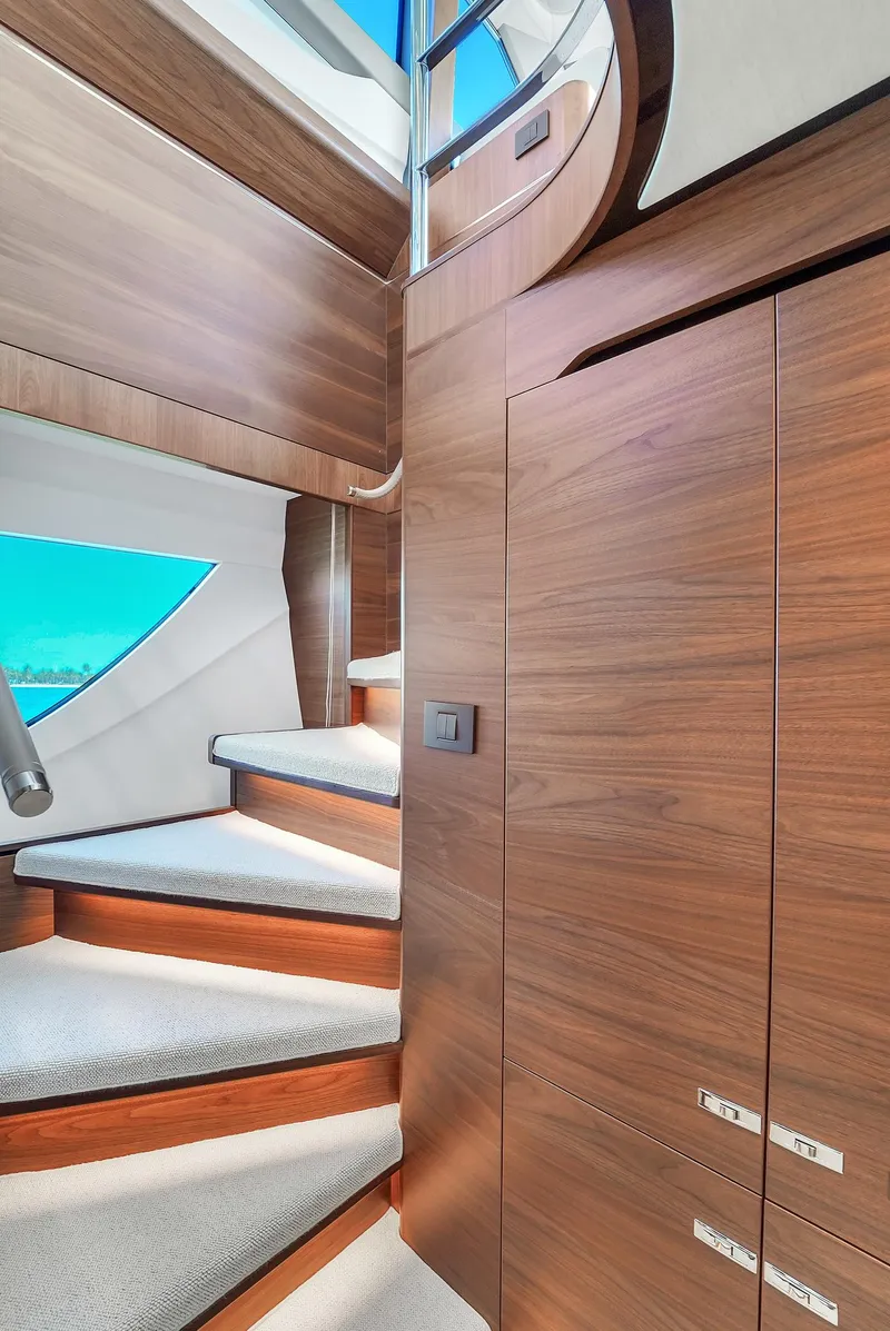 Slide: The Image of Interior staircase of a 2021 Princess Y78 yacht with wooden finish. - 38