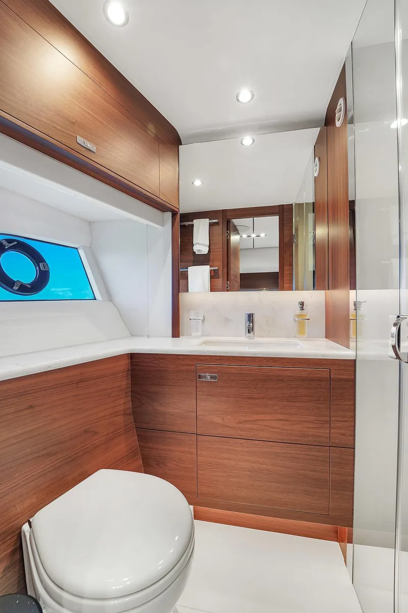 Slide: The Image of Modern bathroom on the 2021 Princess Y78 yacht with wood accents and sleek design. - 49