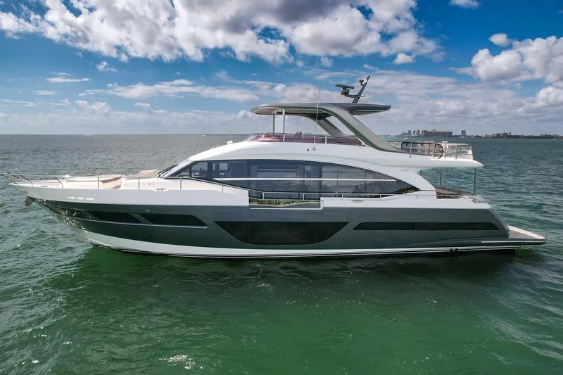 Slide: The Image of 2021 Princess Y78 luxury yacht cruising on open water under a blue sky. - 6