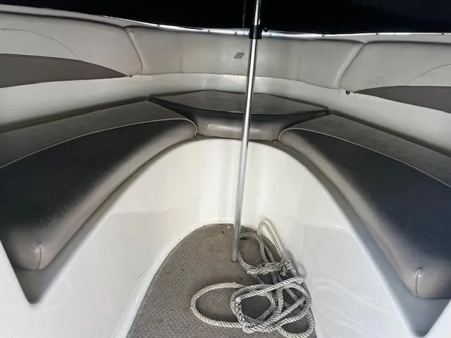 Slide: The Image of Interior of 2003 Four Winns 180 Freedom I/O boat with seating and rope. - 6