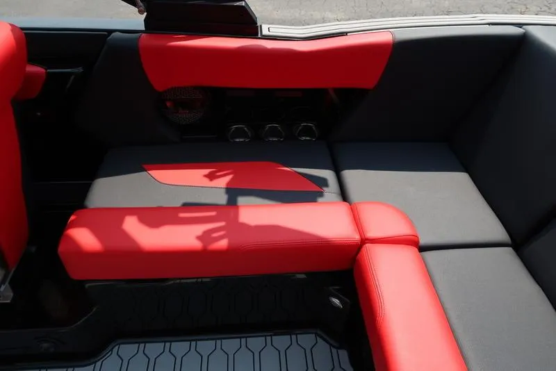 Slide: The Image of 2025 MasterCraft NXT20 interior with red and black seating, showcasing modern design. - 10