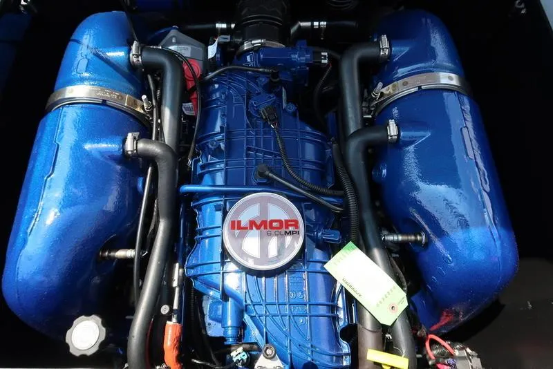 Slide: The Image of 2025 MasterCraft NXT20 engine with Ilmor 6.0L MPI, featuring blue components and detailed wiring. - 17