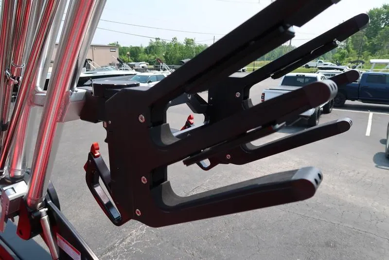 Slide: The Image of Wakeboard rack on a 2025 MasterCraft NXT20 boat in a parking lot. - 29
