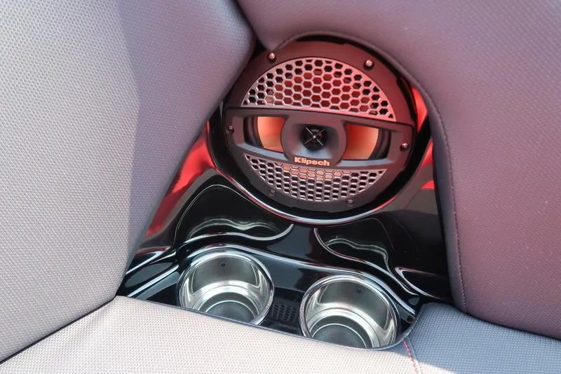 Slide: The Image of 2025 MasterCraft NXT20 boat interior with Klipsch speaker and dual cup holders. - 32