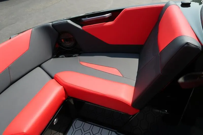 Slide: The Image of 2025 MasterCraft NXT20 boat interior with red and gray seating, modern design. - 33