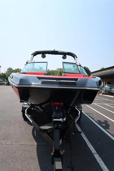 Slide: The Image of 2025 MasterCraft NXT20 boat in parking lot, front view. - 36