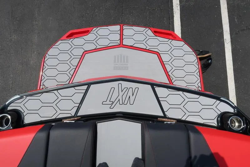 Slide: The Image of 2025 MasterCraft NXT20 boat deck with hexagonal pattern and red accents. - 5