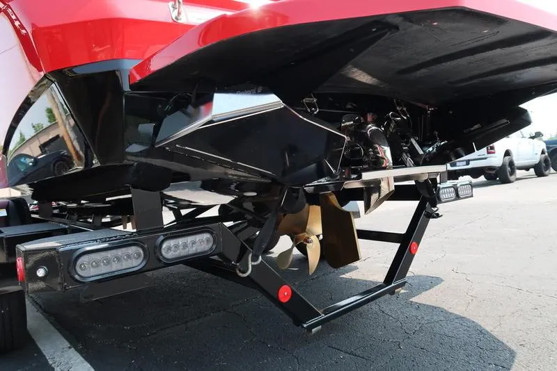 Slide: The Image of 2025 MasterCraft NXT20 boat trailer, rear view, showcasing propeller and undercarriage details. - 9