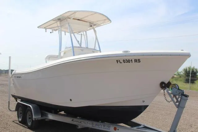 Slide: The Image of 2019 Cobia 220CC boat on trailer, side view. - 3
