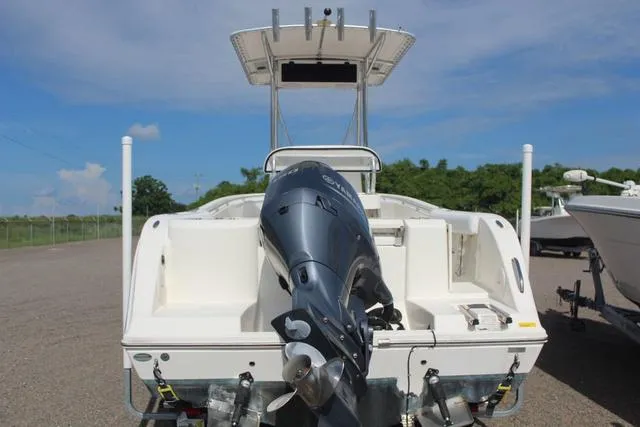 Slide: The Image of 2019 Cobia 220CC boat with outboard motor, rear view. - 4
