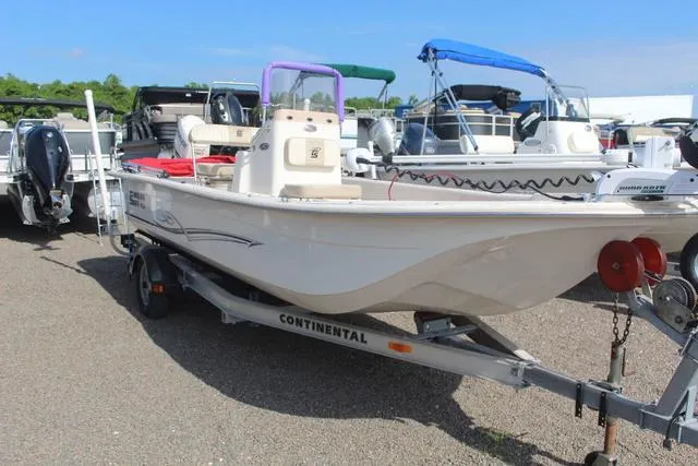 Slide: The Image of 2018 Carolina Skiff 20 JVX CC boat on Continental trailer in a marina. - 3