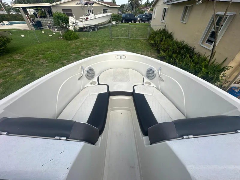 Slide: The Image of 2016 Tahoe 550 TS boat interior with black and white seating. - 11